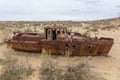 Rusty ship at the ship graveyard in former Aral sea port town Moynaq Mo ynoq or Muynak , Uzbekist Royalty Free Stock Photo