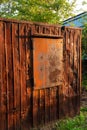 Rusty shipping container with closed window. Abandoned place with large container Royalty Free Stock Photo