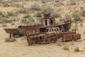 Rusty ships at the ship graveyard in former Aral sea port town Moynaq Mo ynoq or Muynak , Uzbekist Royalty Free Stock Photo