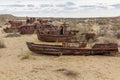 Rusty ships at the ship graveyard in former Aral sea port town Moynaq Mo ynoq or Muynak , Uzbekist Royalty Free Stock Photo