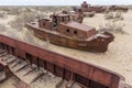 Rusty ships at the ship graveyard in former Aral sea port town Moynaq Mo ynoq or Muynak , Uzbekist Royalty Free Stock Photo