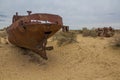 Rusty ships at the ship graveyard in former Aral sea port town Moynaq Mo ynoq or Muynak , Uzbekist Royalty Free Stock Photo