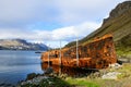 Rusty shipwreck in the fjord