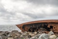 Rusty shipwrecked boat on a beach