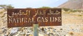 Rusty sign, natural gas line in the desert Royalty Free Stock Photo