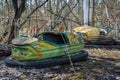 Rusty small children cars in abandoned amusement park in Pripyat, Chernobyl exclusion zone