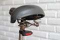 Old bicycle seat on white wall background Royalty Free Stock Photo
