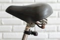 Old bicycle seat on white wall background Royalty Free Stock Photo