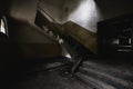 Rusty staircase inside a dark old abandoned building