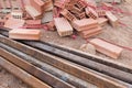 Rusty steel beams and red bricks on construction site background