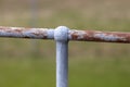 A rusty steel fence post and hand rail Royalty Free Stock Photo