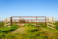 Rusty steel gate closed with ropes Royalty Free Stock Photo