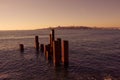 Rusty steel pipe stakes coming from out of sea Royalty Free Stock Photo