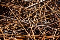 Rusty steel rebar scraps. Stack of rusty iron rods or bars Royalty Free Stock Photo