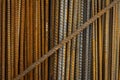 Rusty steel rods. Material for the construction of buildings and houses. Strong metallic material forming a repeating pattern