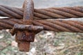 Rusty Steel Ropes with Shiny U-Bolt Clamp on Blue Sky Background. Business Teamwork Support Together Concept. Royalty Free Stock Photo