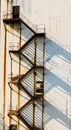 Rusty steel staircase is built on the outer wall of an abandoned factory Royalty Free Stock Photo