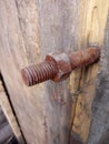 Rusty stud with thread and screwed nut
