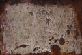 Rusty surface of beige metal plate. Rusty texture backdrop. Rust and burn on old metal. Rust on beige fence. Royalty Free Stock Photo