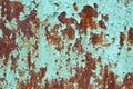 Rusty surface of metal plate with blue cracked color paint. Rust on old colored metal. Old blue fence. Grunge ruststained metal Royalty Free Stock Photo