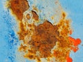 Rusty surface of metal plate with blue cracked color paint. Royalty Free Stock Photo