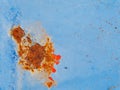 Rusty surface of metal plate with blue cracked color paint. Royalty Free Stock Photo