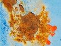 Rusty surface of metal plate with blue cracked color paint. Royalty Free Stock Photo