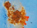 Rusty surface of metal plate with blue cracked color paint. Royalty Free Stock Photo