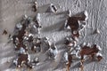 Rusty surface with peeling white paint. Corroded metal texture