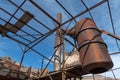 A rusty tank suspended opn scaffolding in an abandoned lead mine near Bonnie Claire, Nevada, USA