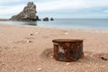 Rusty tin can on the beach Royalty Free Stock Photo