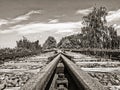 Rusty tracks of a disused railroad line leading to nowhere, sepia toned image Royalty Free Stock Photo