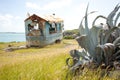 Rusty trailer by the sea in Antigua