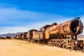 Rusty train cemetery by Uyuni in Bolivia