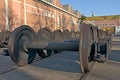Train wheel sets in front of an industrial building Royalty Free Stock Photo