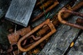 Rusty Turnbuckles discarded with some weathered lumber Royalty Free Stock Photo