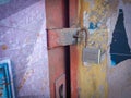 A rusty unlocked lock on an old iron door. Royalty Free Stock Photo