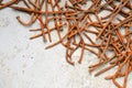 Rusty nails on a cement metal background Royalty Free Stock Photo