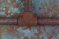 Rusty valve pipes on rusty metal wall Royalty Free Stock Photo