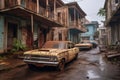 rusty vehicles parked in front of deserted houses Royalty Free Stock Photo