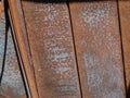 Rusty vertical iron plates, construction elements of a deserted building