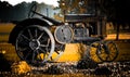 rusty vintage farm tractor on display in a rural farm with bright flowers early morning Royalty Free Stock Photo