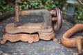 Rusty vintage sewing machine on a wooden table in the garden Royalty Free Stock Photo