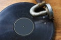 A rusty vintage vinil player  plays an old shabby dusty gramophone record disc Royalty Free Stock Photo