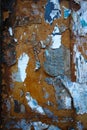 Rusty wall with peeling paint and torn paper Royalty Free Stock Photo