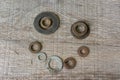 Rusty Washer Happy Face Conceptual Art on Grey Timber