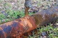 Rusty water pipe with leaking tap, closeup Royalty Free Stock Photo