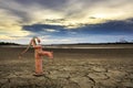 Rusty water pump on land.