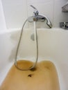 Rusty water running from a faucet