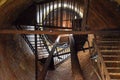 Rusty water tower inside view from top to bottom. Old water pump. Ladder to water tank, pigeon droppings Royalty Free Stock Photo